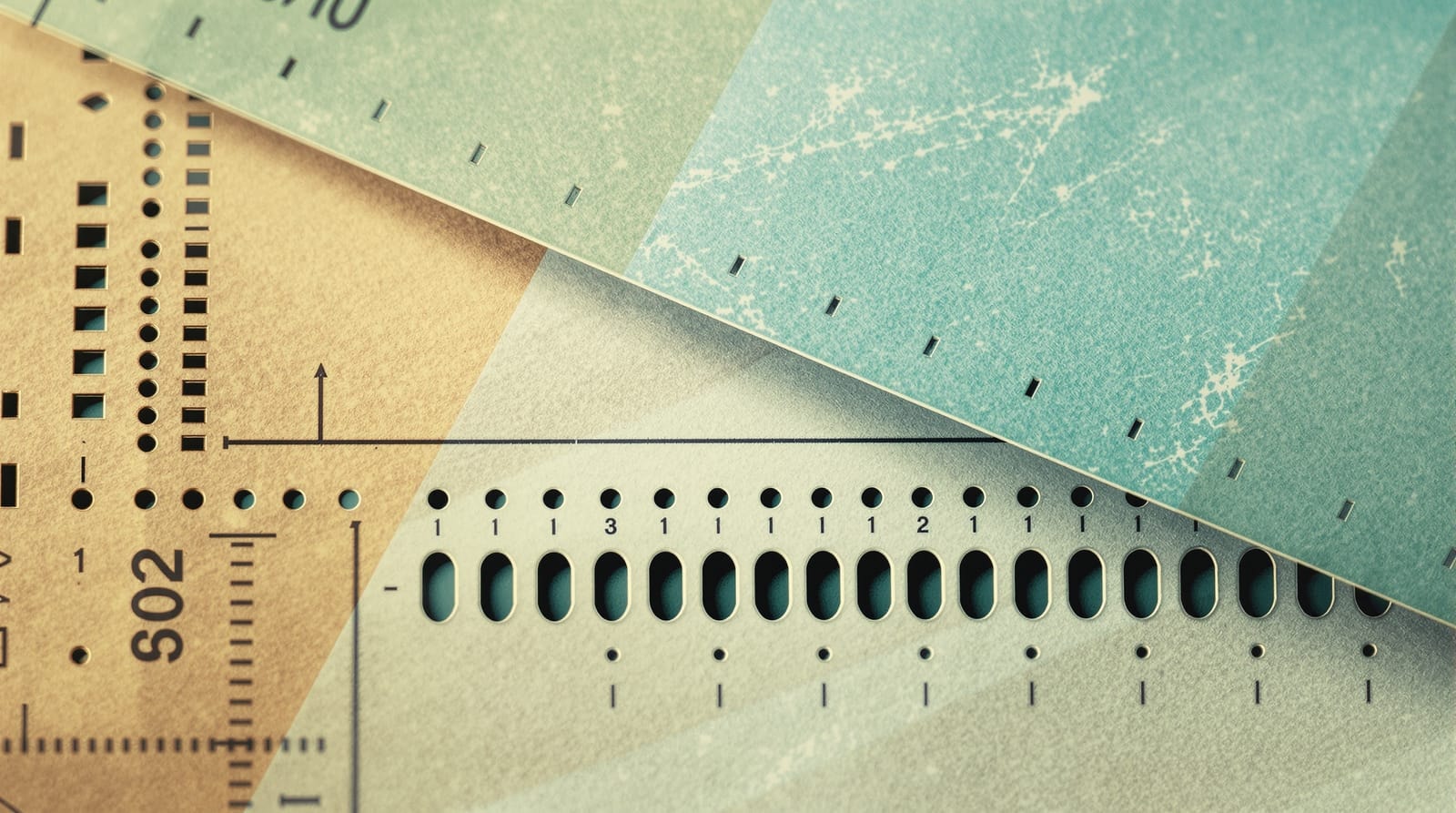 Macro study of a punched card overlapping a blank optical-scan ballot form with empty ovals